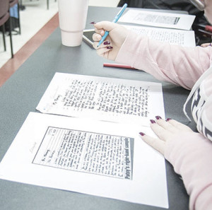 A student in Robinson's class works on a handwriting analysis assignment derived from the JonBenet Ramsey case.
