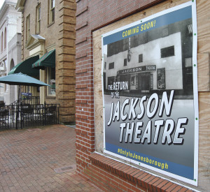 A sign on the front of the Jackson Theatre building touts the renovations, which will restore the Jackson to its 1940s splendor. PHOTO BY DAVE ONGIE