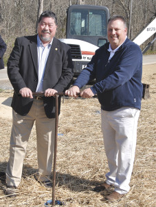 Johnson City Mayor David Tomita and Washington County Commissioner Bryan Davenport take part in the ceremonial valve-turning to mark the completion of the first phase of the Ford Creek Water Extension Project.