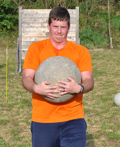 Joe Story carries a stone medicine ball similar to the ones used in the World’s Strongest Man competition.