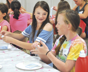 A gooey science project provides some entertainment. Attendees were able to choose from a list of 32 activities