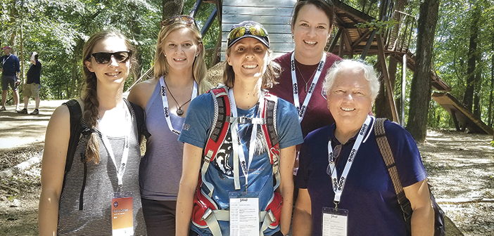 Kayla Carter, Emily Mayo, Katie Dunn, Idalina Walker and Jenny Brock at a mountain bike jump near Bentonville, Ark. CONTRIBUTED