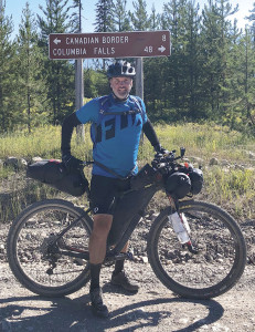 Jeff Rowland and his mountain bike - which was weighed down with supplies - shortly after crossing the border between Canada and Montana.