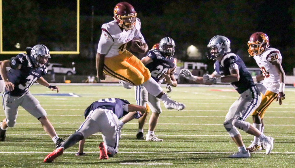 Science Hill running back Drew Morrison hurdles over the Farragut defense during a game last season. PHOTO BY ROBERT KELL