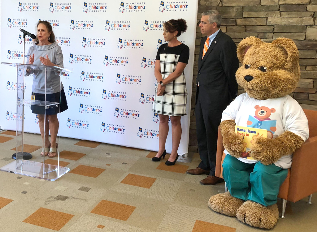 Dr. Anne Littleford, principal at South Side Elementary School, speaks during a press conference last week as Niswonger Children's Hospital CEO Lisa Carter and Ballad Health CEO Alan Levine look on. CONTRIBUTED