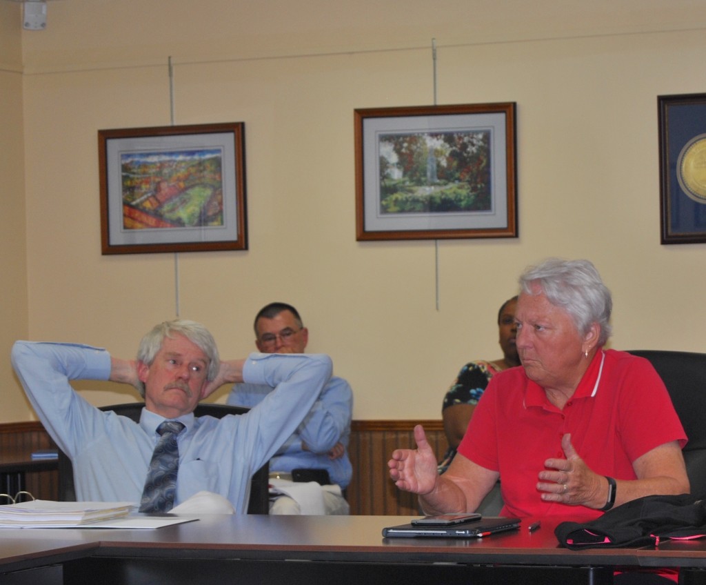 With his trademark binder in front of him, Ralph Van Brocklin listens as Johnson City vice-mayor Jenny Brock speaks during a Johnson City Commission workshop in June of this year. Photo by Dave Ongie