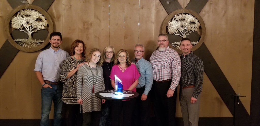 Employees and management of WCQR show off the Station of the Year trophy general manager Adam McCain accepted on behalf of the station at an awards dinner last week in Orlando, Florida. WCQR was named the top medium-market Christian radio station in the country. CONTRIBUTED