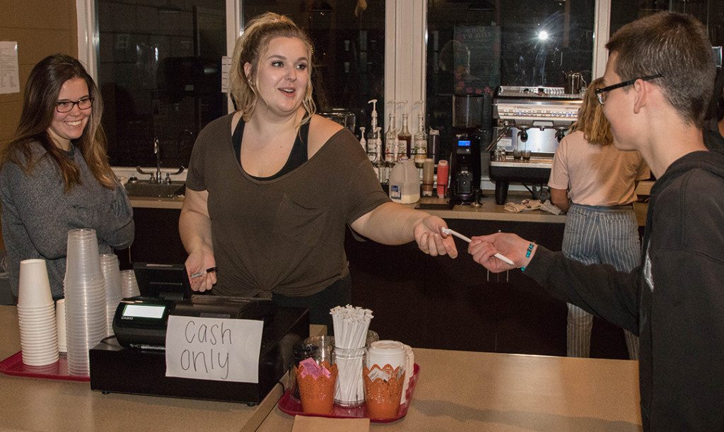 Lauren Gardner hands a straw to a student while working at the Hillside Cafe. Established in 2016, the full-service coffee shop provides Science Hill students with the opportunity to gain real-life business experience. PHOTO BY COLLIN BROOKS