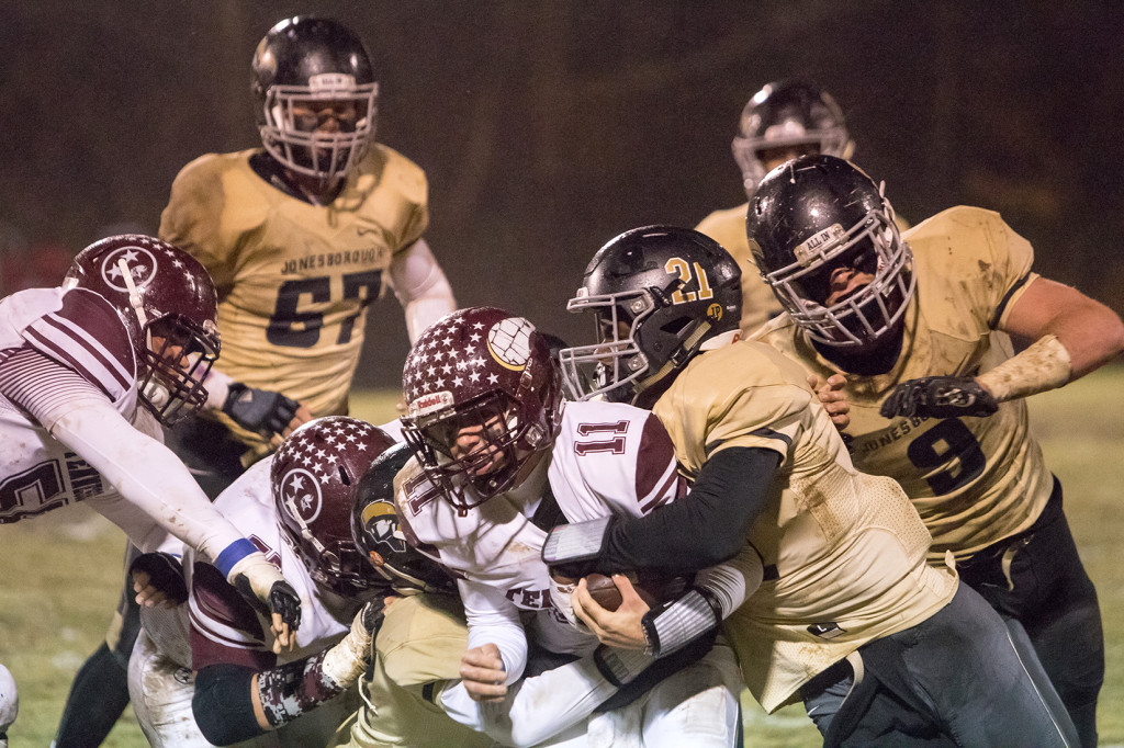 A host of David Crockett defenders bring down a Tennessee High ballcarrier during Crockett’s 32-0 whitewashing of the Vikings in the second round of the TSSAA football playoffs last Friday in Jonesborough. PHOTO BY COLLIN BROOKS