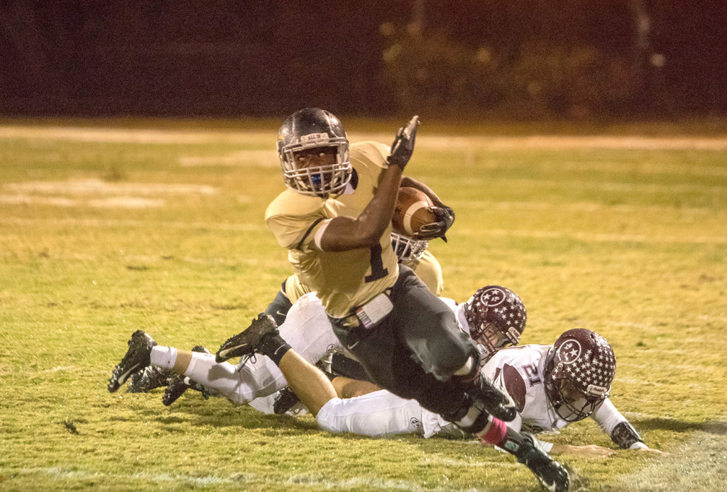 Crockett running back Ronquille Joyner scoots away from a pair of Tennessee High defenders during last week’s game. The Pioneers will hit the road to face Knox Central in the state quarterfinals this Friday night. PHOTO BY COLLIN BROOKS