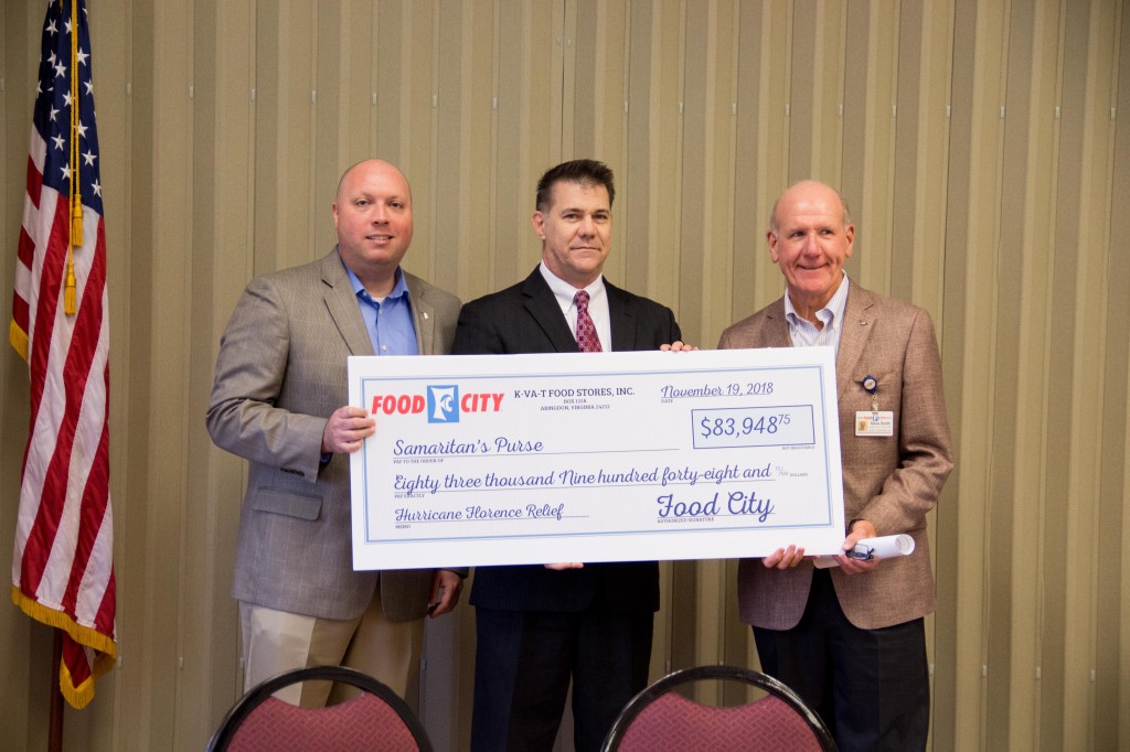 Food City president and CEO Steve Smith (right) and vice-president of marketing Kevin Stafford (left) make a donation to Steve Tomlin, regional director of donor ministries for Samaritan’s Purse, during a ceremony on Monday in Bristol. CONTRIBUTED