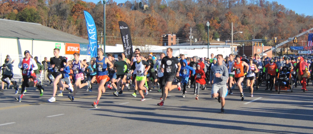 Runners break from the starting line during the 13th annual Turkey Trot 5K, which is held on Thanksgiving morning. A record number of runners and walkers participated in this year’s event, which is put on by race director Karen Hubbs of Goose Chase with plenty of support from the City of Johnson City. PHOTO BY DAVE ONGIE