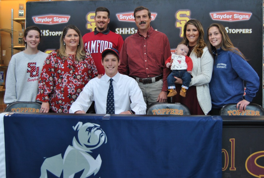 Science Hill all-state cross country runner Jeb Jones recently signed scholarship papers to continue his career at Samford. Jones was an all-state performer in each of his last three seasons at Science Hill and holds several school records. PHOTOS BY DAVE ONGIE