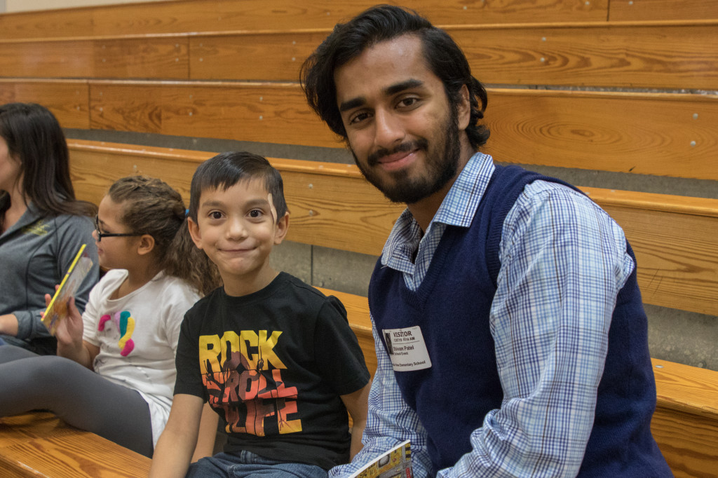 Lazaro Simon-Whitman (left) chats with his Vello tutor Shivam Patel during an event at Mountain View Elementary School last Friday. PHOTO BY COLLIN BROOKS